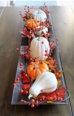 gourds and berries on a tray