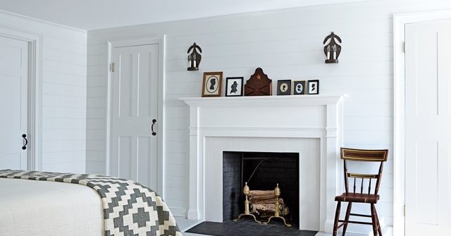 white bedroom with fireplace