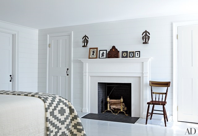 white bedroom with fireplace